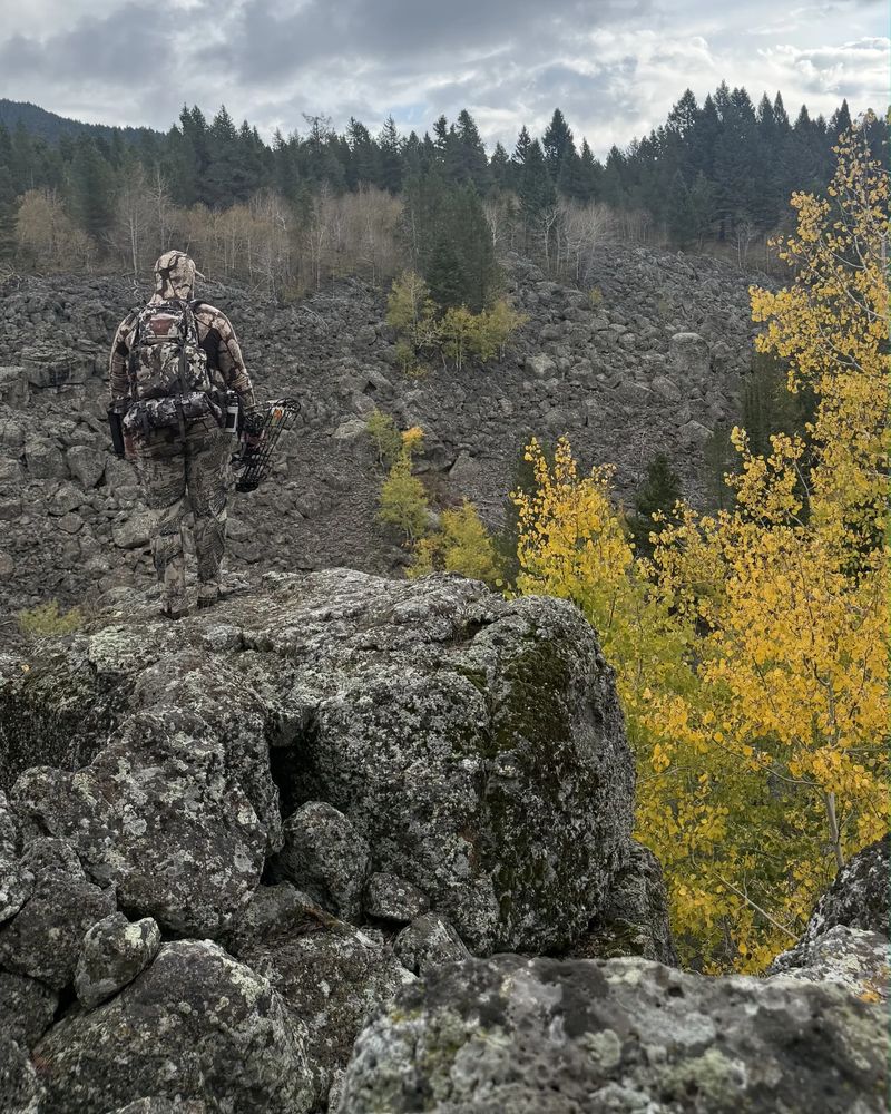 Cody 'Moose' Nolan overlooking a rocky canyon with fall aspens in Eastern Idaho